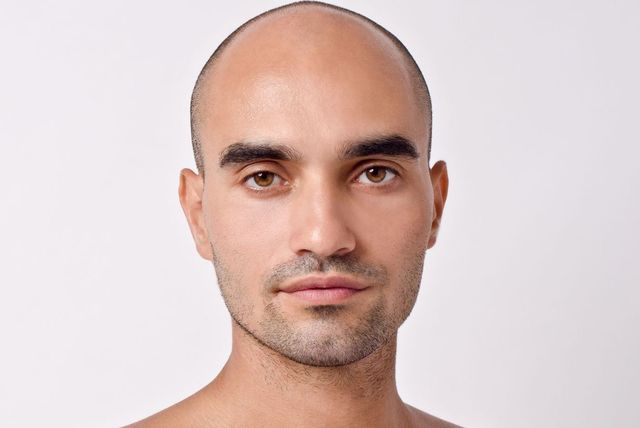 Natural buzz-cut illusion on a shaved head